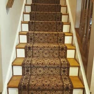 If your home has beautiful hardwood steps, I would opt for a stair runner.