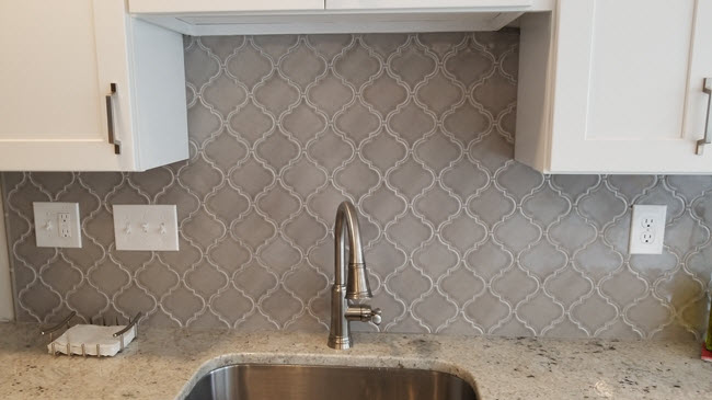 Notice the arabesque backsplash and how well it ties into the countertop selection.