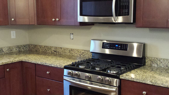 Kitchen before with a standard 4" Granite Splash 