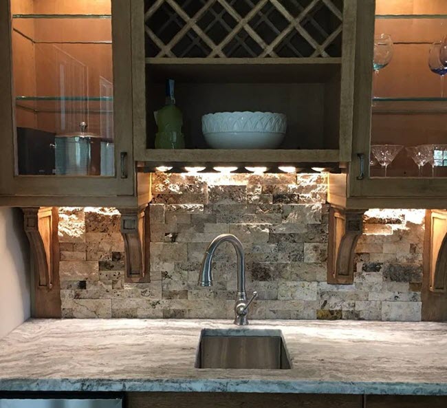 Here lighting does a beautiful job of highlighting the surface texture of the stone as well as the textural quality of the individual ledger pieces.