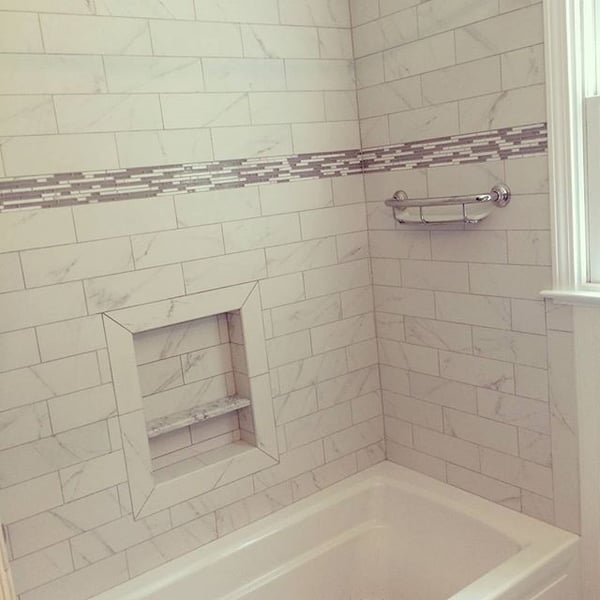 he bathroom installation below features a porcelain marble-look subway tile.