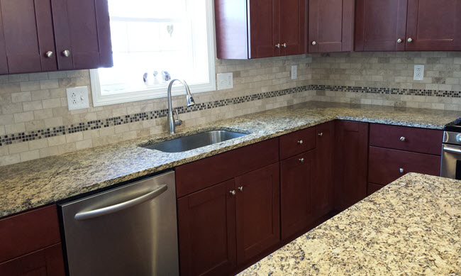 Kitchen backsplash after with a Custom Subway Tile and Glass Mosaic