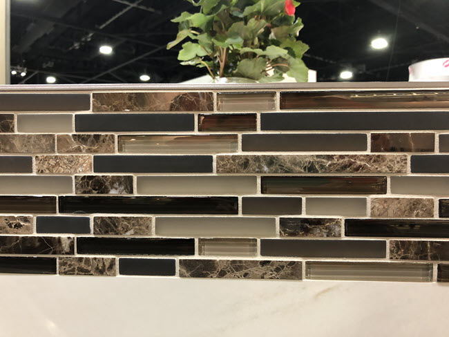 Glass tile strips mixed with natural stone