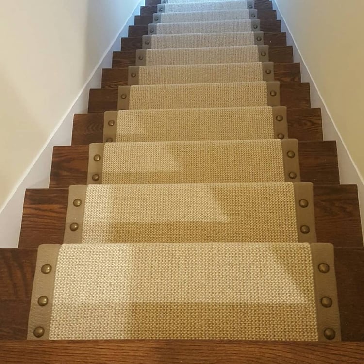 Carpeted stairs with nailheads