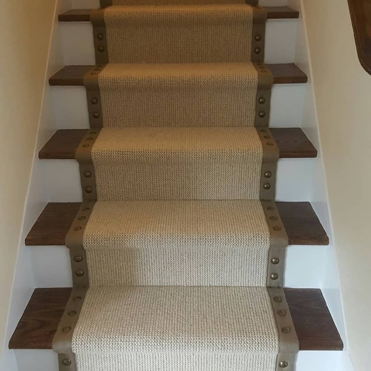 This stair runner features nailheads along the border