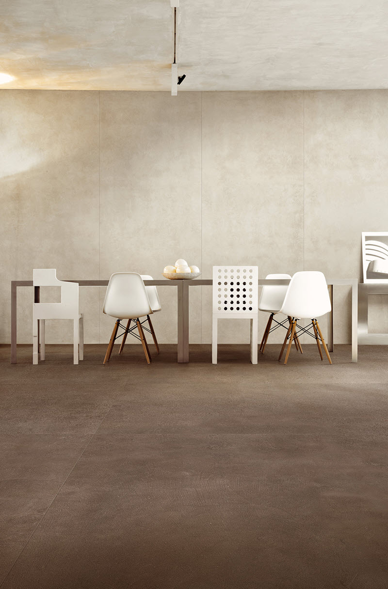 This first example features porcelain wall panels and floor tiles with a concrete look in two distinct colorways.