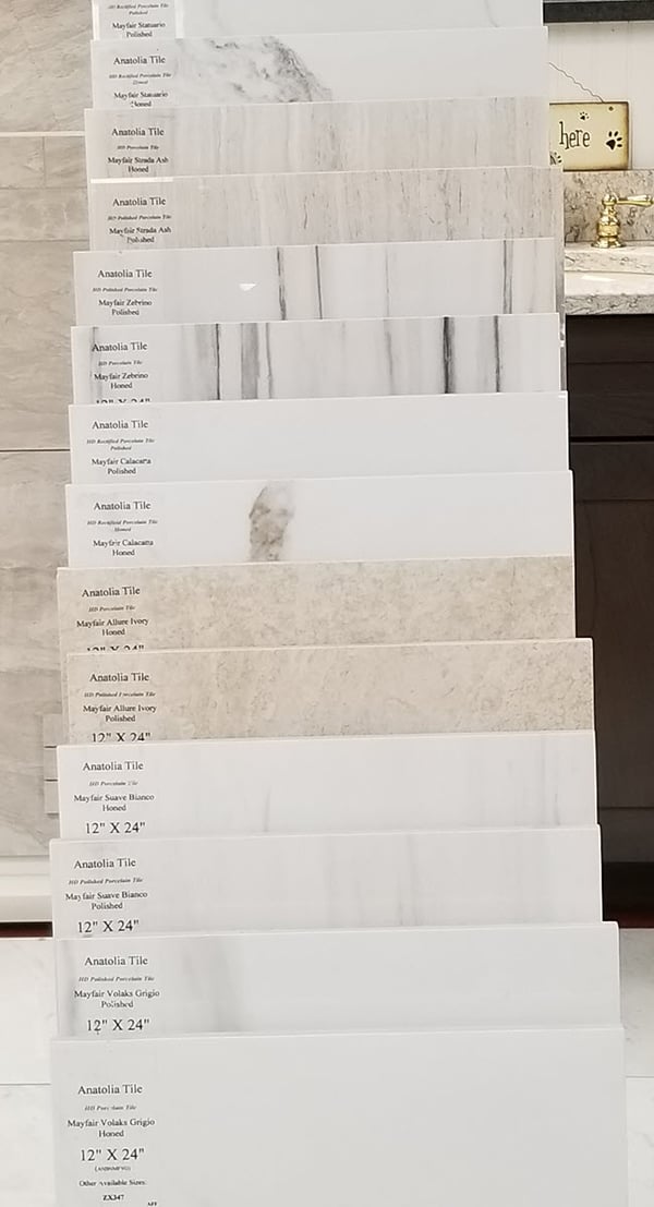 The display below of 12"x24" tile includes polished, honed and rectified samples in a range of marble patterns and colors.