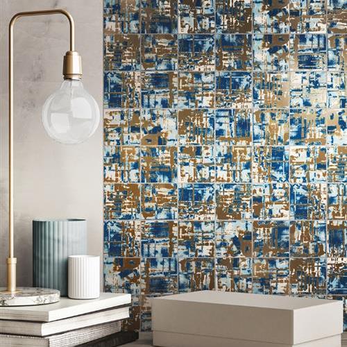 Una Kora Series Oceana which is a 3"x3" glazed porcelain wall tile and combines warm gold shades with classic blue.