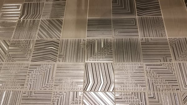 That concept translates well to linear patterns, interspersed with solid tile.