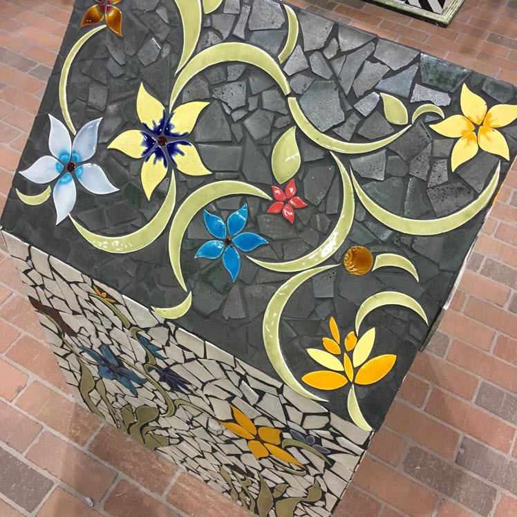 Here is one of the tiled doghouses from a recent Coverings event where yellow and gray combine beautifully with other touches of color.