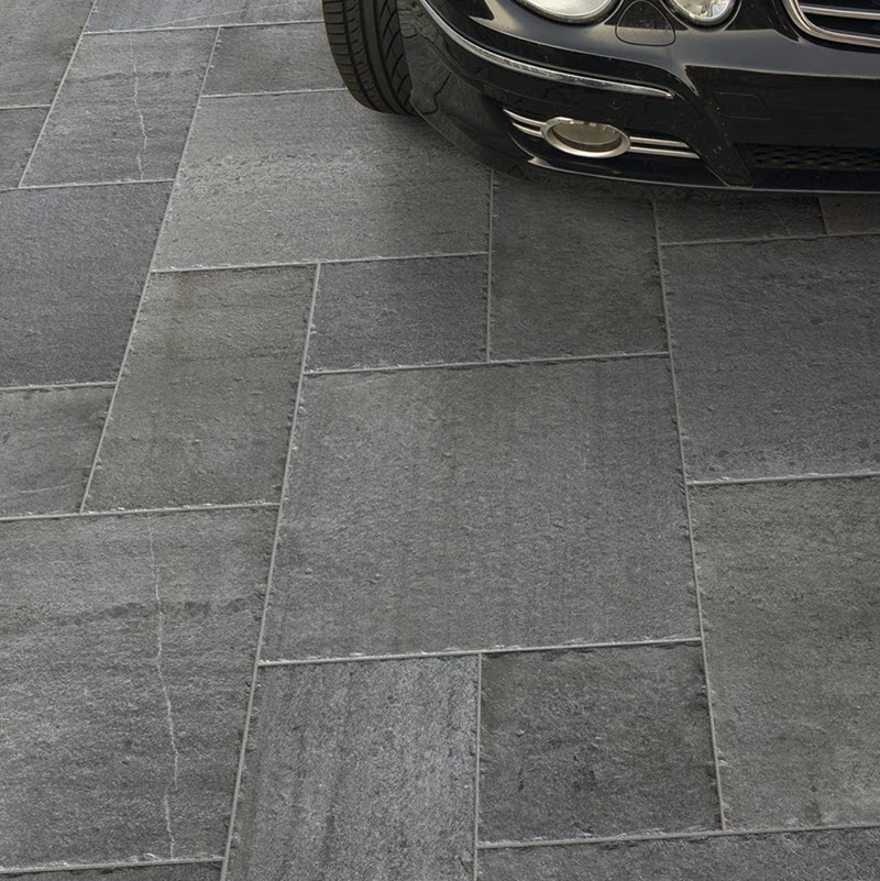 You might have a space that extends from a garage to a patio. In that case, stone-look porcelain tile might be just the solution for creating this Roman-inspired pattern.